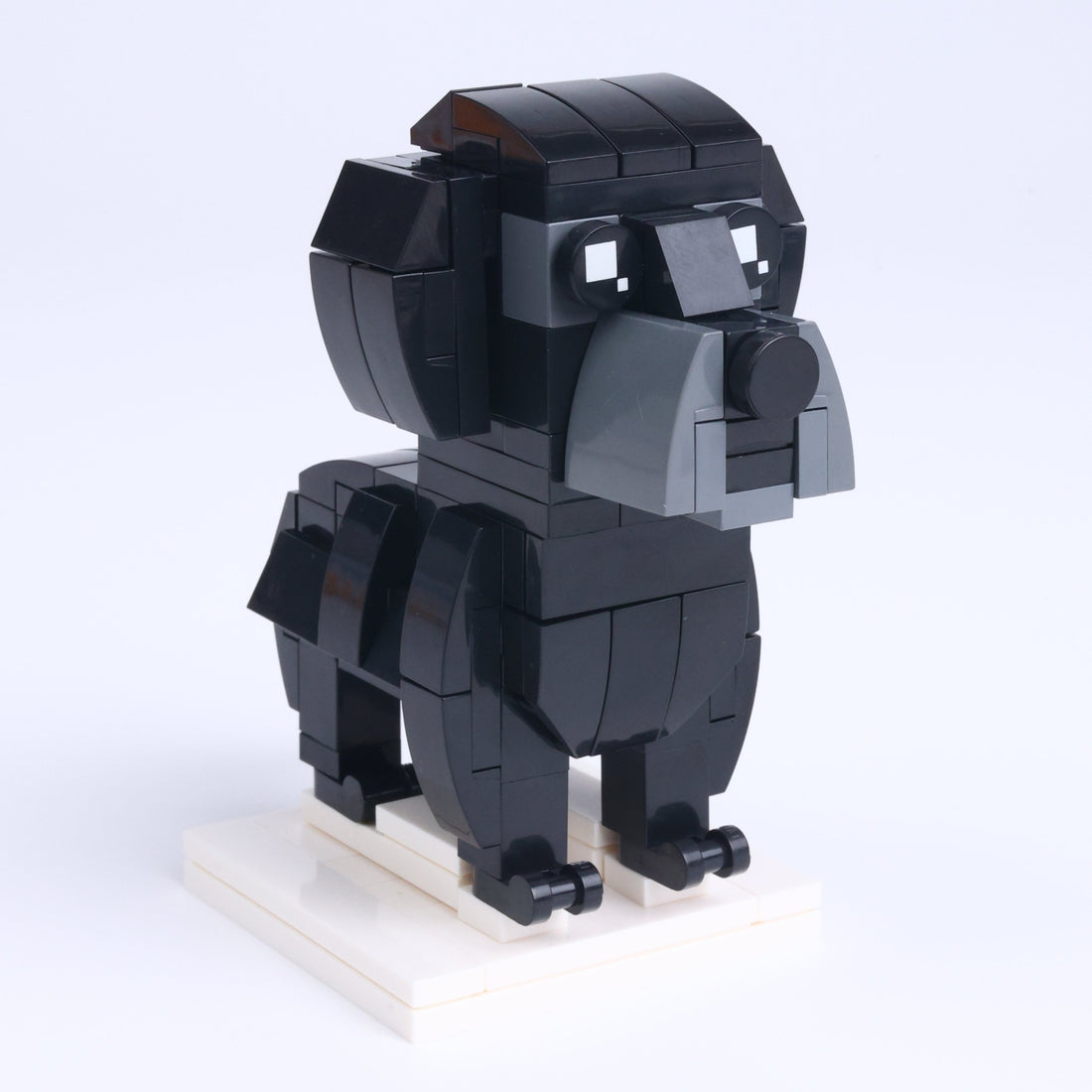 Black Labrador dog brick figure, left-side view
