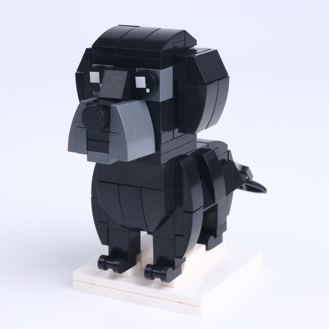 Black Labrador dog brick figure, right-side view