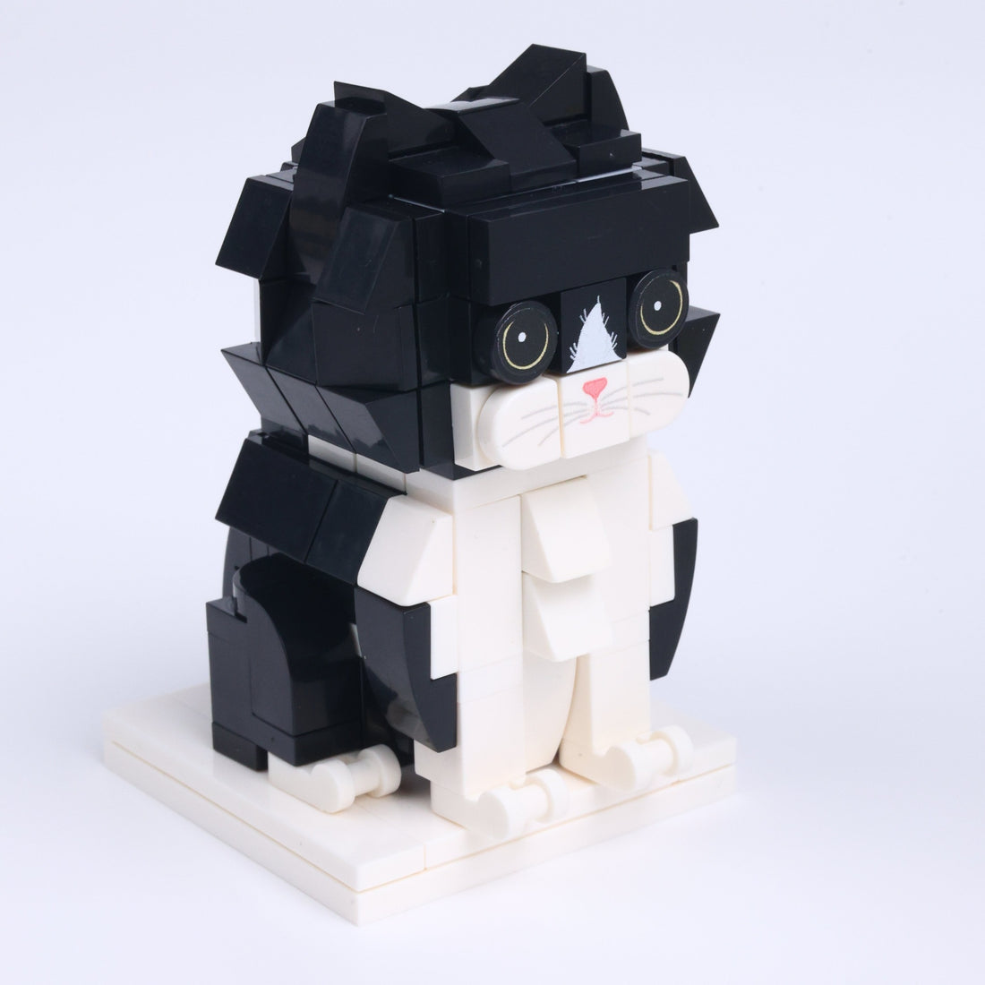 Black White Longhair cat brick figure, left-side view