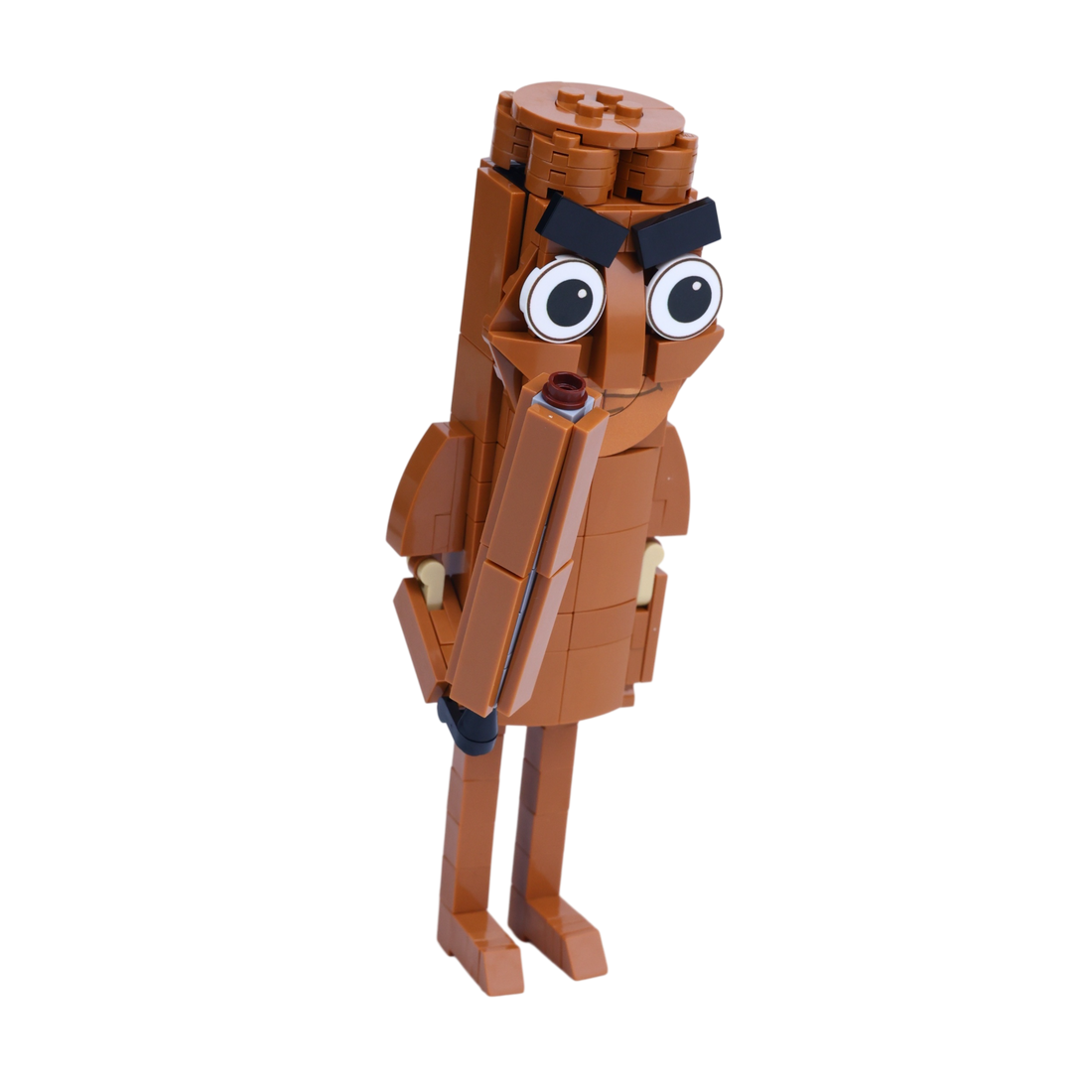 Brown Stick Man brick art collectible, left-side view