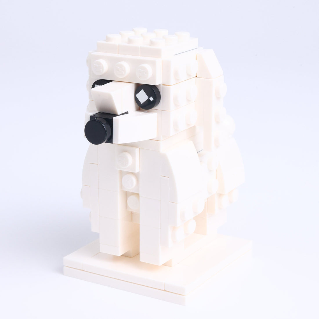 White Poodle dog brick figure, right-side view