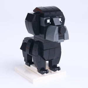 Black Labrador dog brick figure, left-side view