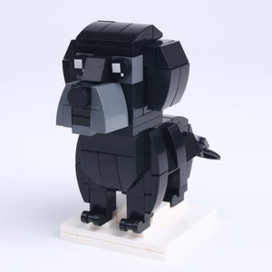 Black Labrador dog brick figure, right-side view